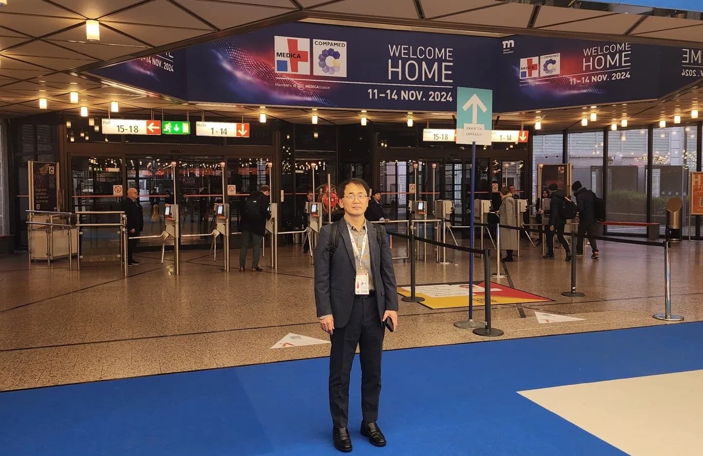 MTechLab representative at the MEDICA 2024 exhibition entrance