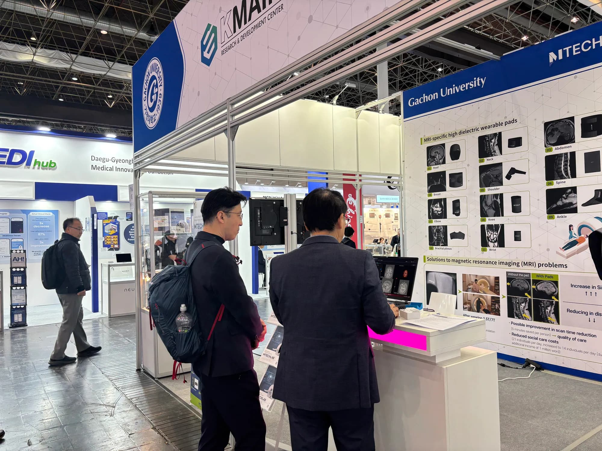 Visitor at the MTechLab MRI technology booth during MEDICA 2025