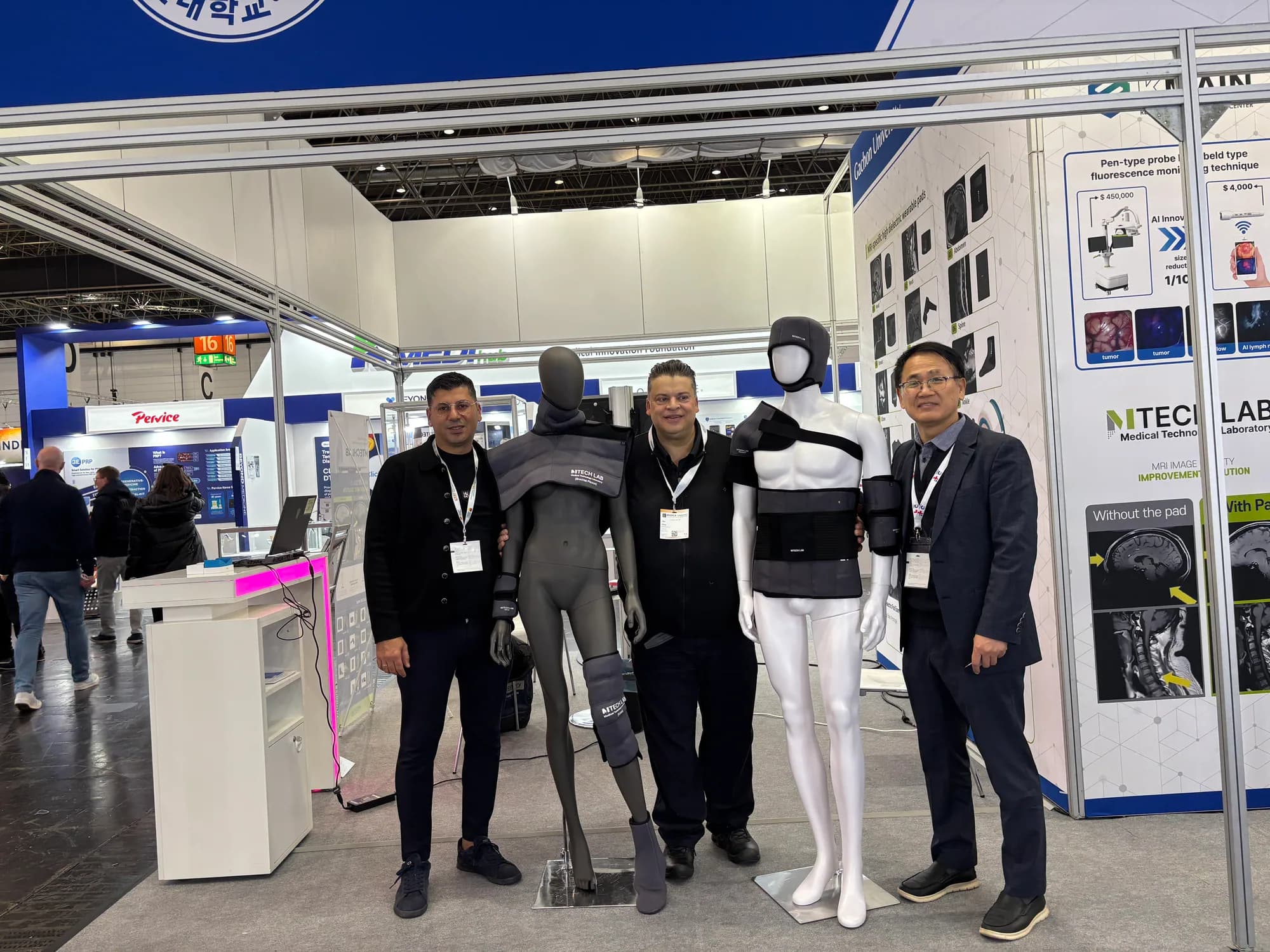 Group photograph beside mannequins displaying MTechLab MRI dielectric pads