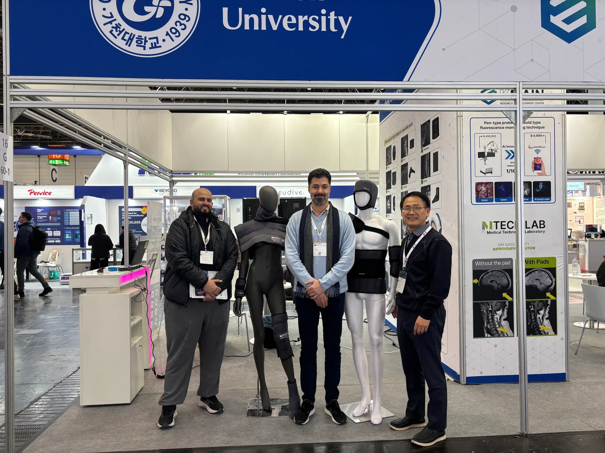 Group of visitors and representatives at the MTechLab MEDICA 2025 booth