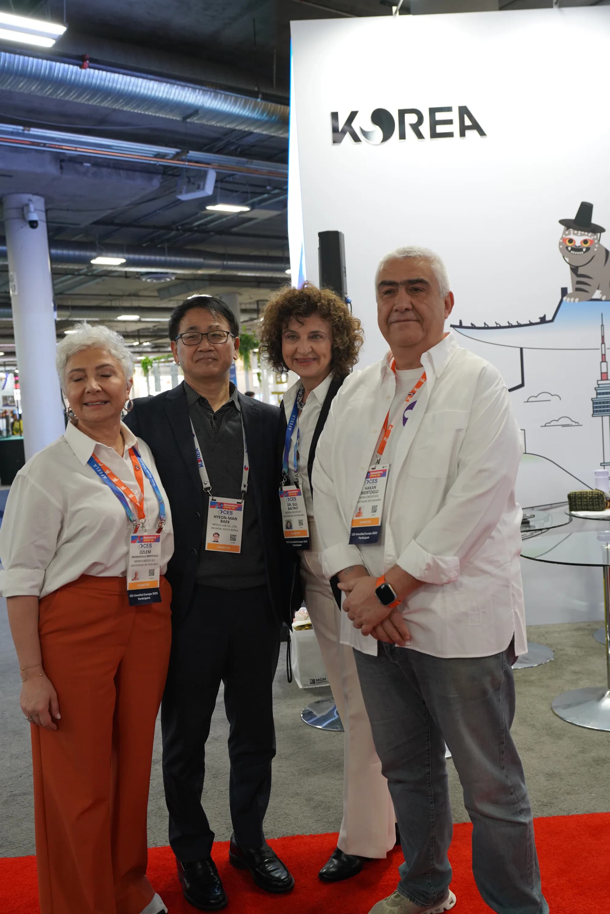 MTechLab and MORLA Moves representatives together at the exhibition booth